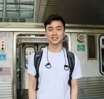 A young man at a train station
