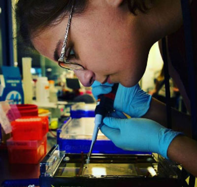 A young woman working in a lab